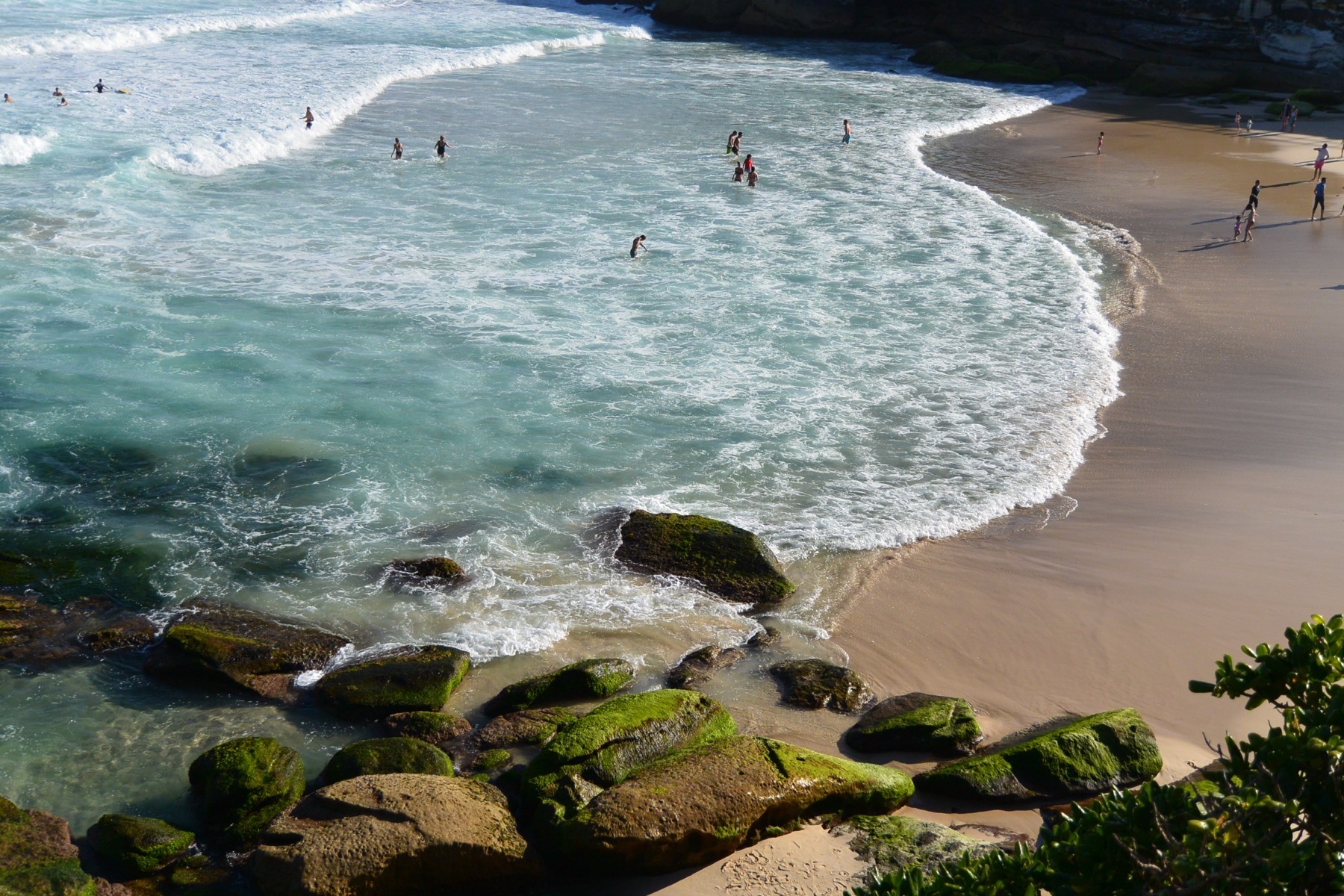 Surf washing into a sandy cove